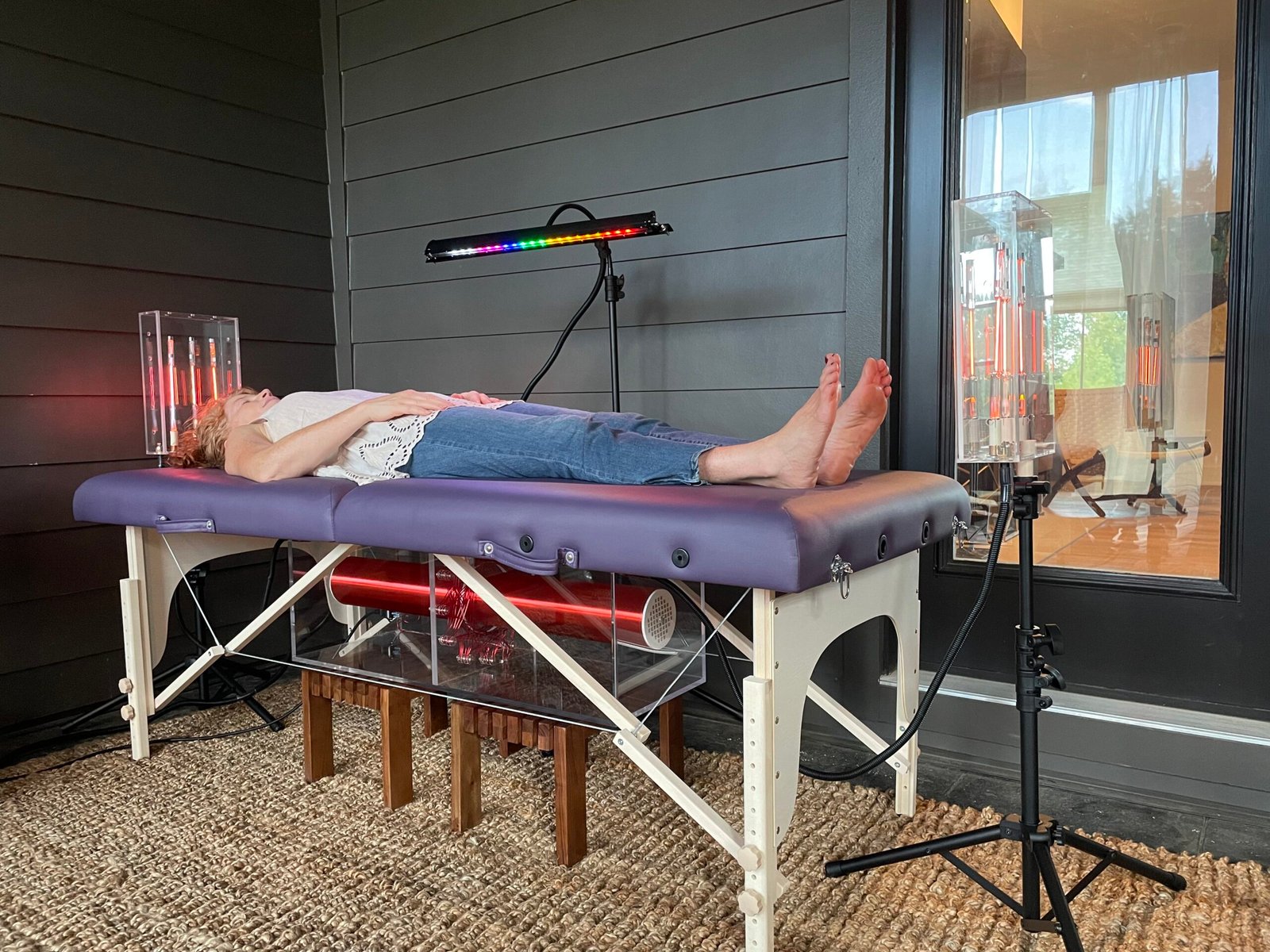 Tesla Wellness Table with noble gas lamps creating a toroidal energy field for quantum entanglement healing